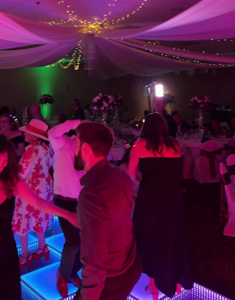 Dance Floor Guests Under Purple Event Lighting in Los Angeles