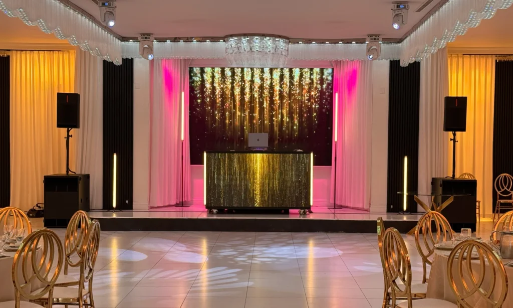 Professional DJ booth, speakers, lighting and LED video wall at a Los Angeles event venue