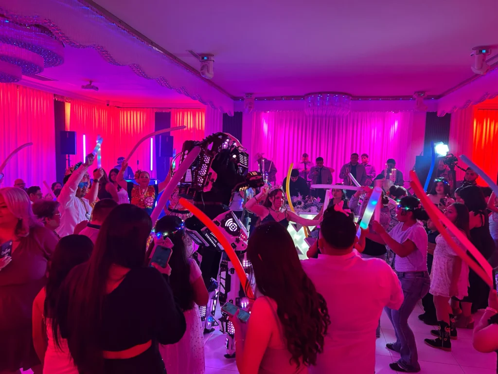 LED robot performer entertaining guests on a colorful Los Angeles party dance floor
