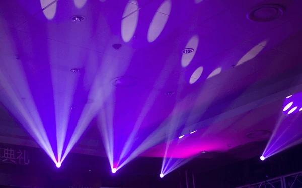 Purple event lighting beam effects on a dance floor